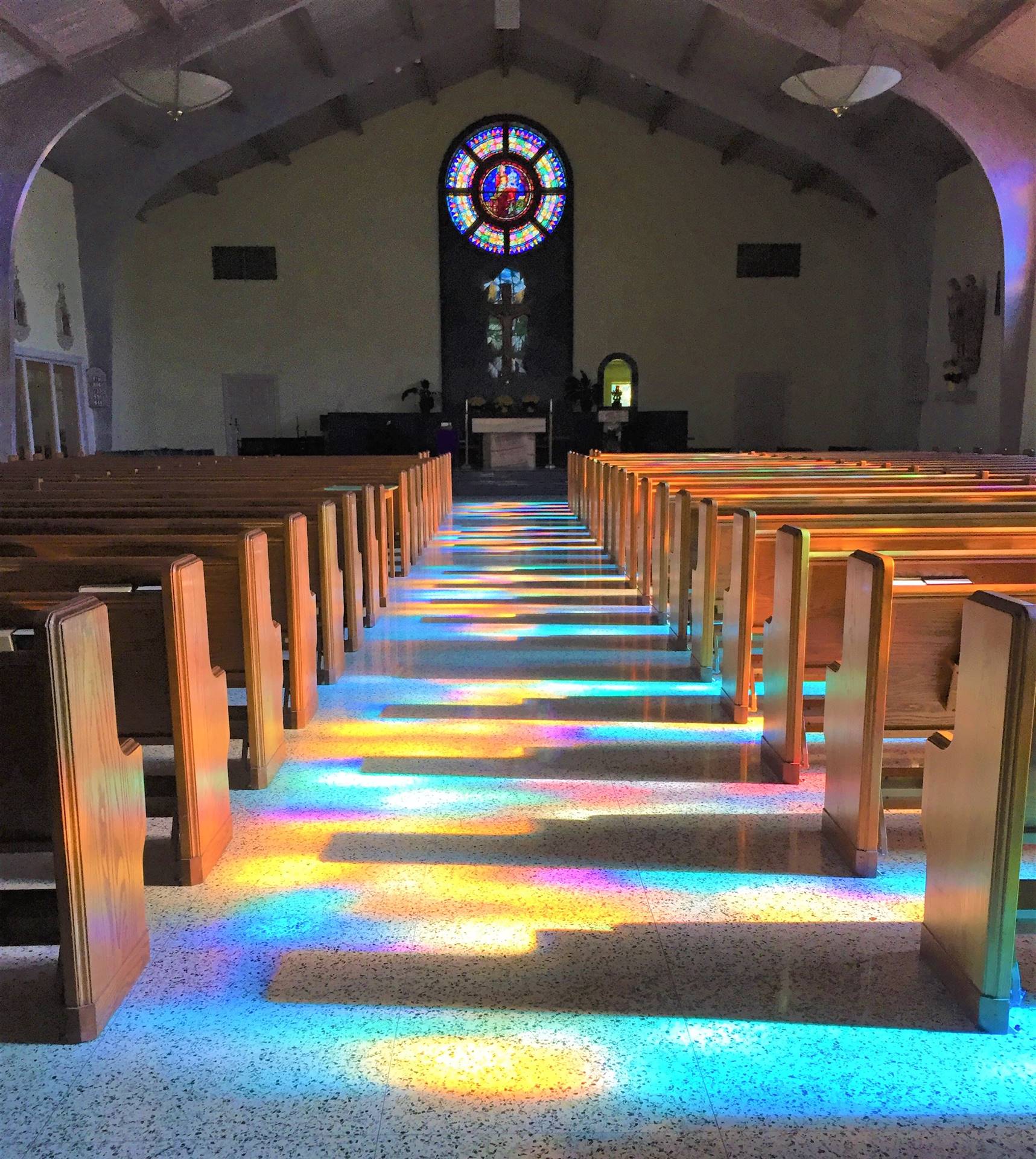 Stained Glass Windows Shining Into the Church